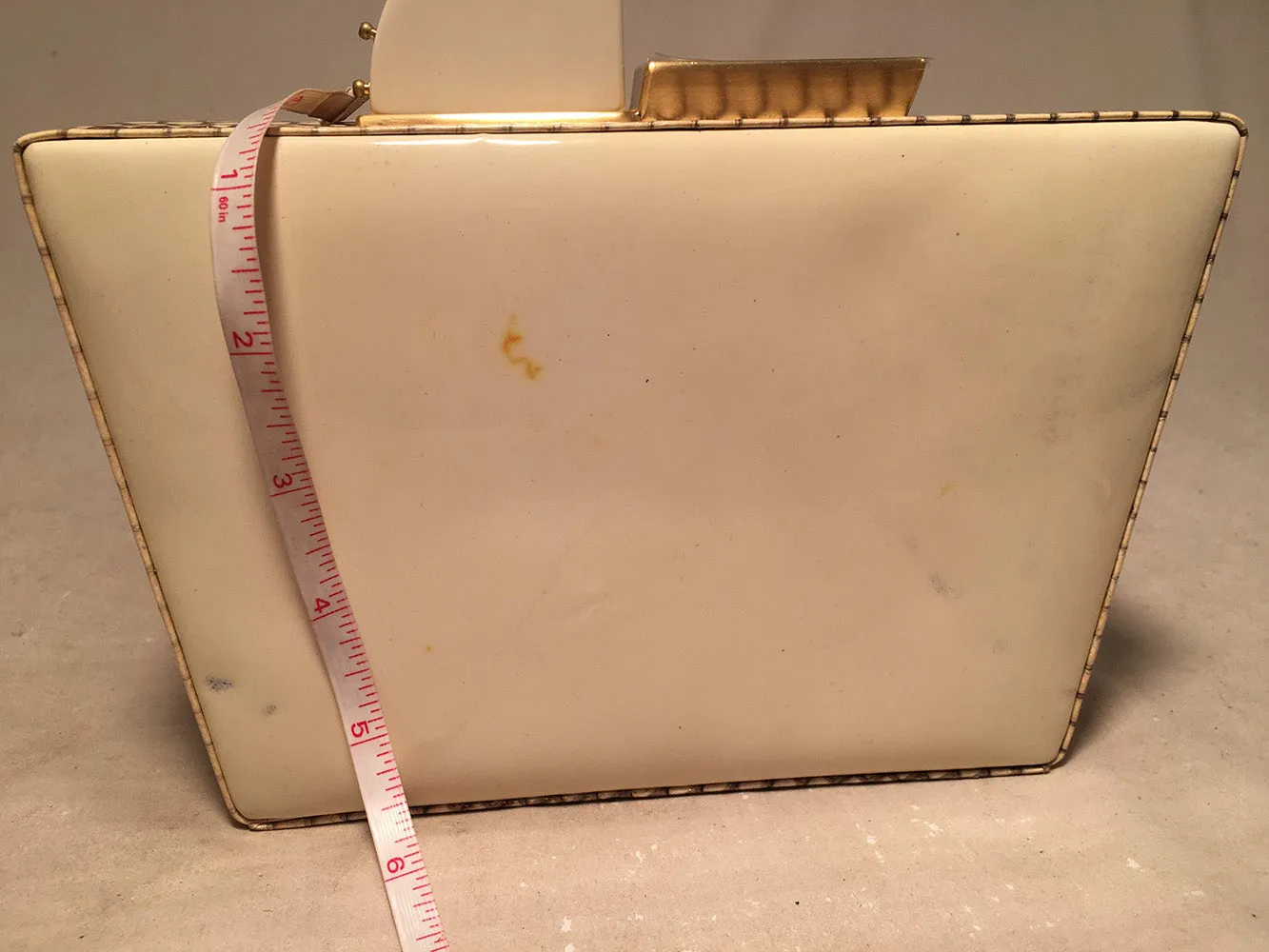 Tonya Hawkes Cream Embossed Patent Leather Clutch