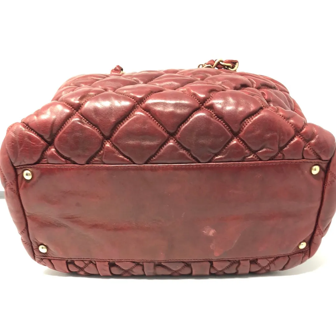 VINTAGE: Chanel Deep Red Leather Quilted double handle Bubble bag with gold textured CC